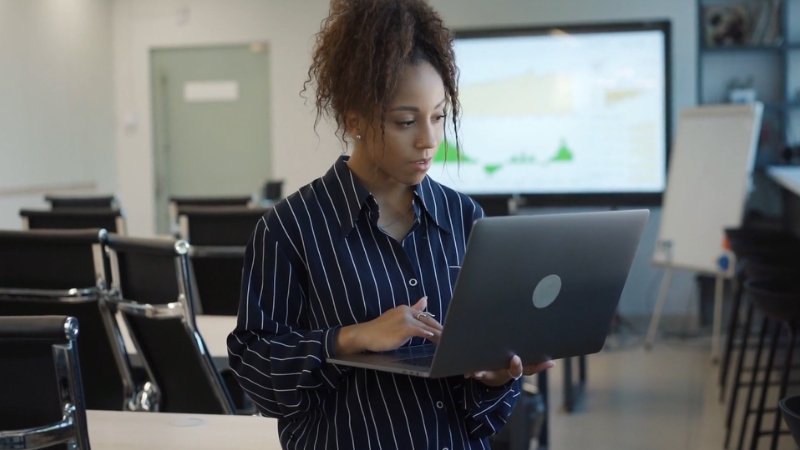 Person working on a laptop in an office