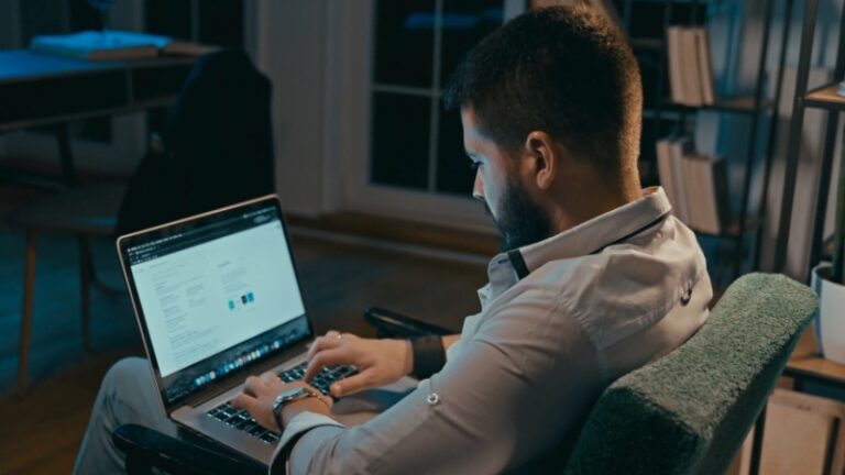 A person working late at a desk, focused on building authority online without relying solely on SEO