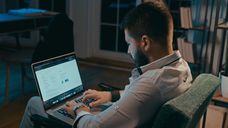 A person working late at a desk, focused on building authority online without relying solely on SEO