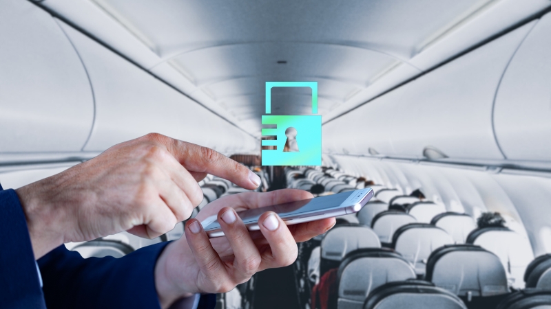 A person secures their mobile device with a lock icon while in an airplane